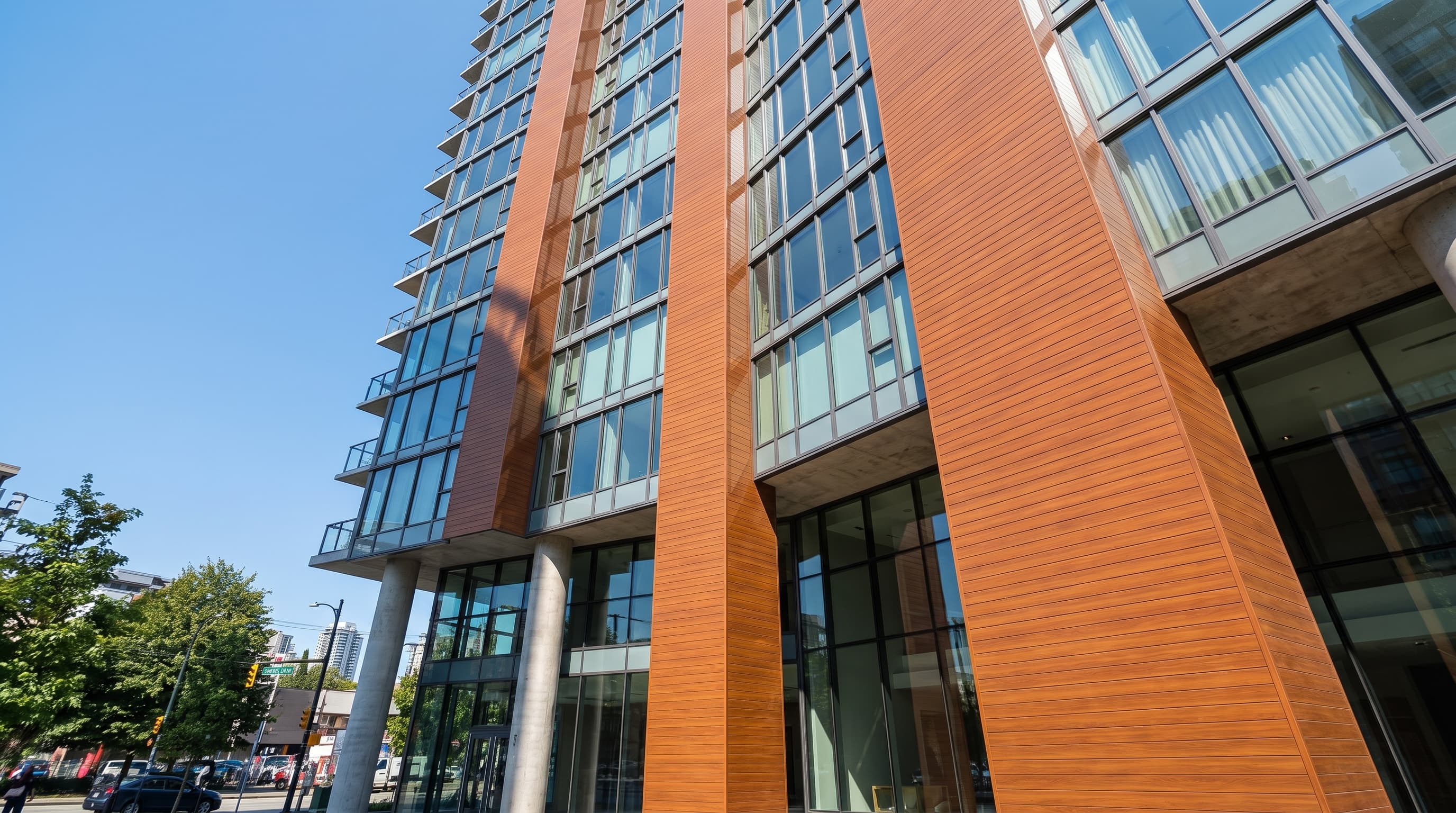 Tall facade combining wood-grain linear cladding and dark panel fields