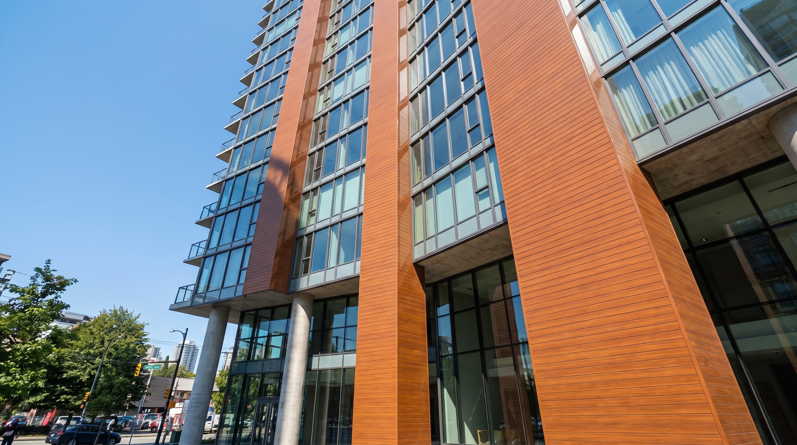 Architectural study of linear wood-look cladding meeting a glazed commercial facade